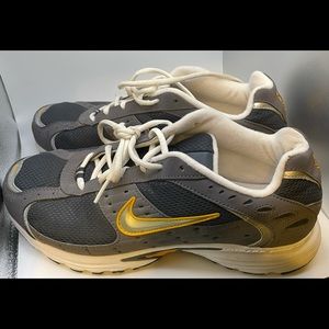 Grey and gold  Nike tennis shoe